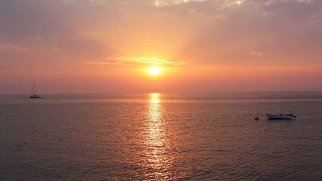 Sunset over the water at Totland Bay